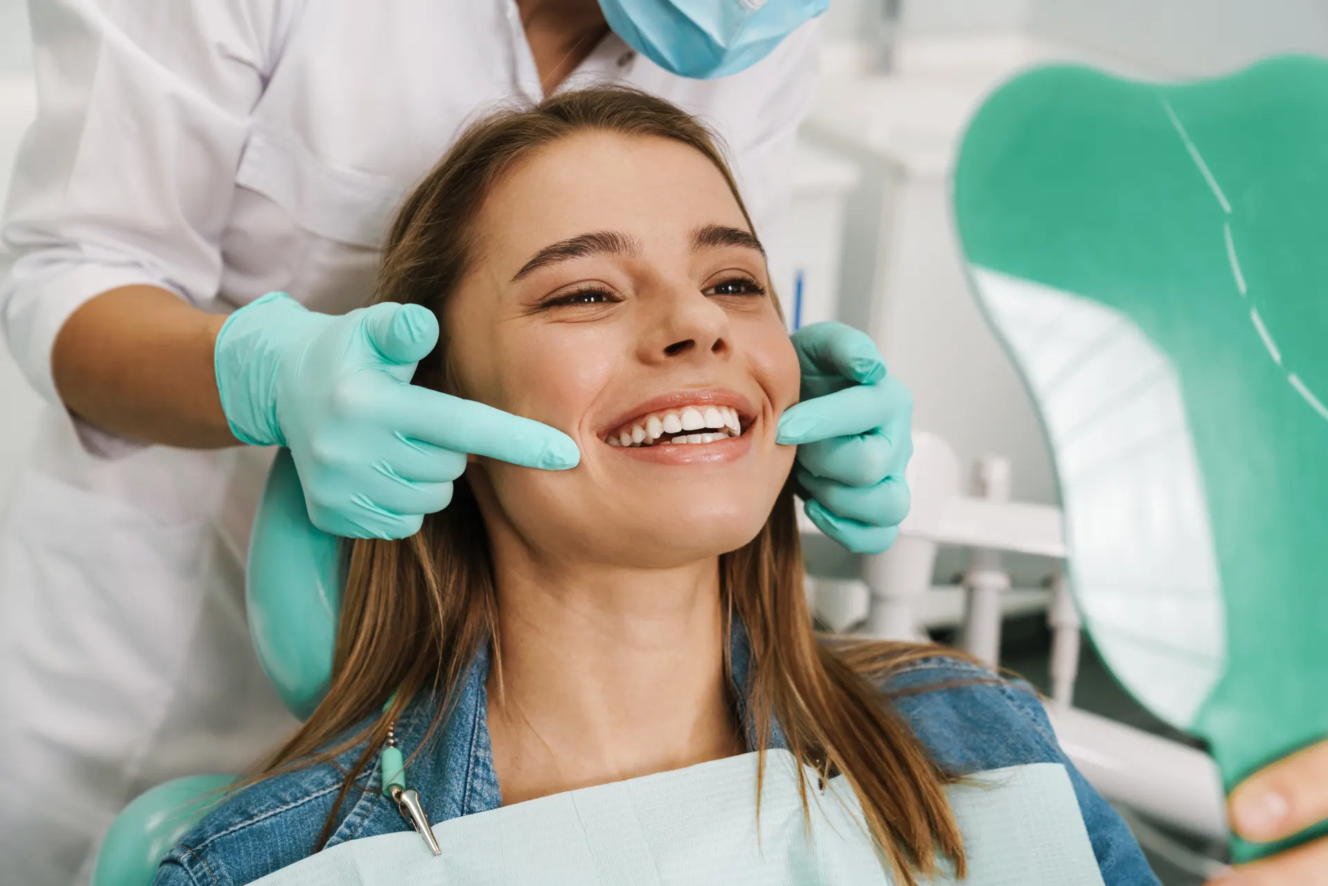 Smiling patient receiving dental care