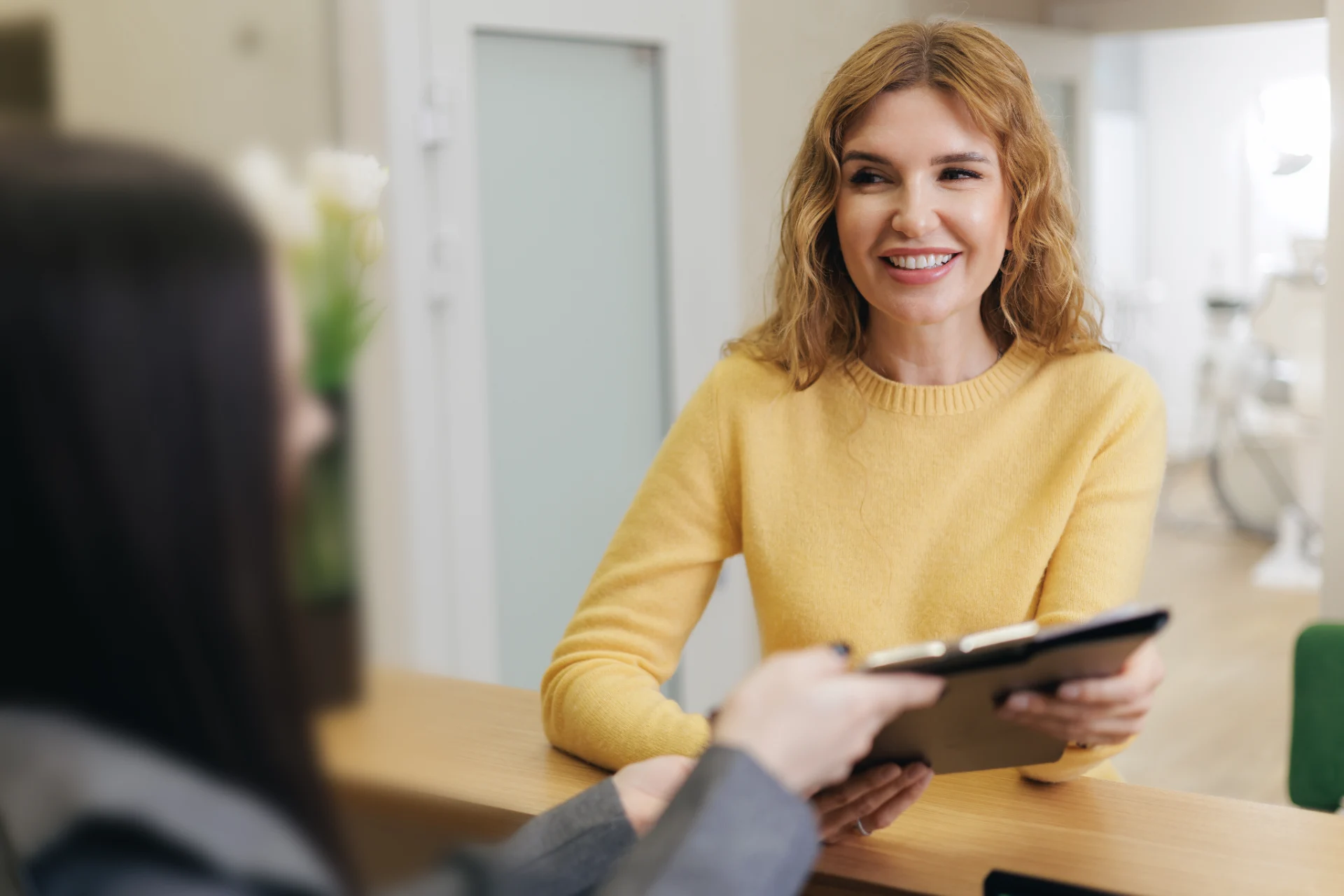 Smiling patient discussing dental care at Anaheim Smile Center