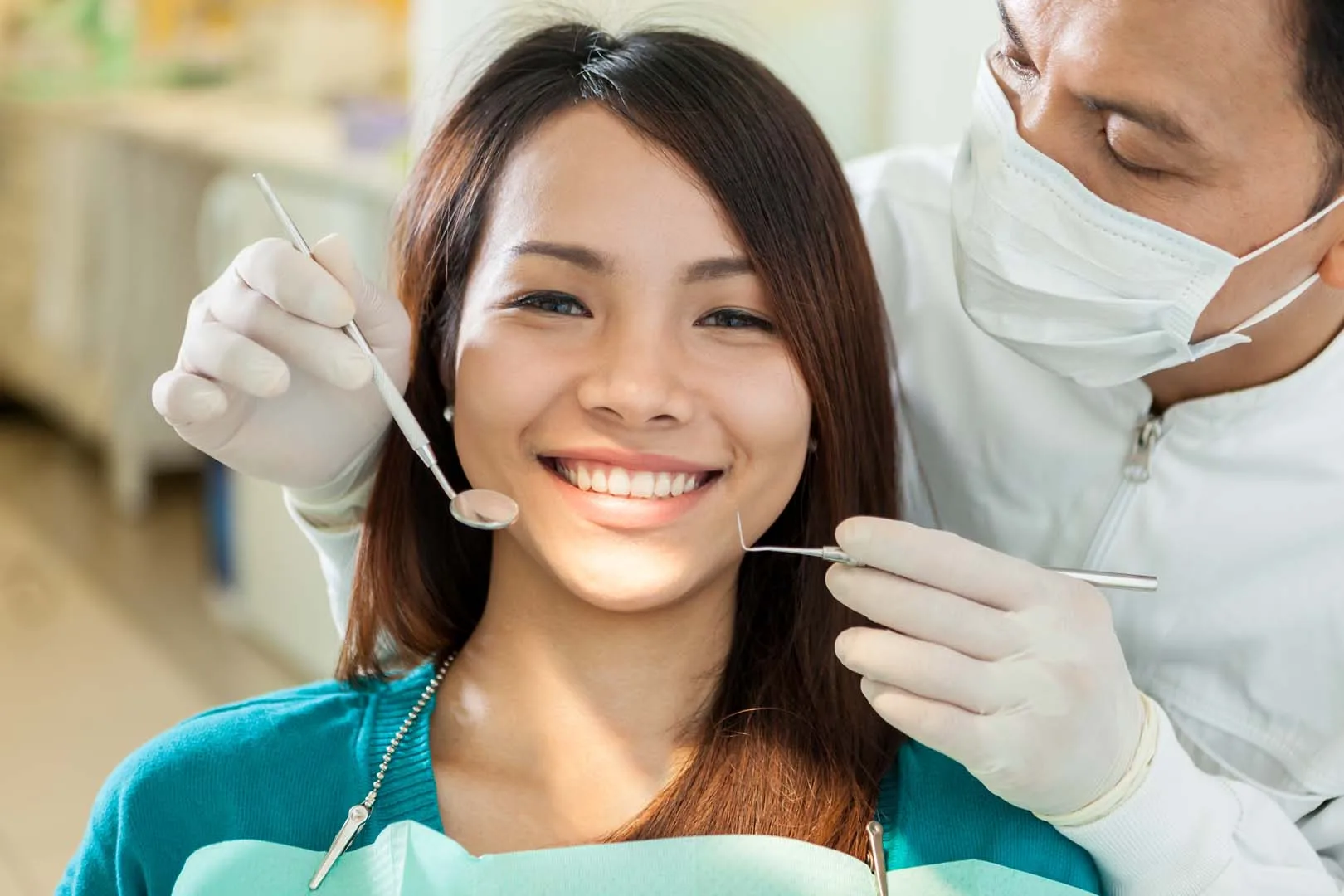 Smiling patient receiving dental care