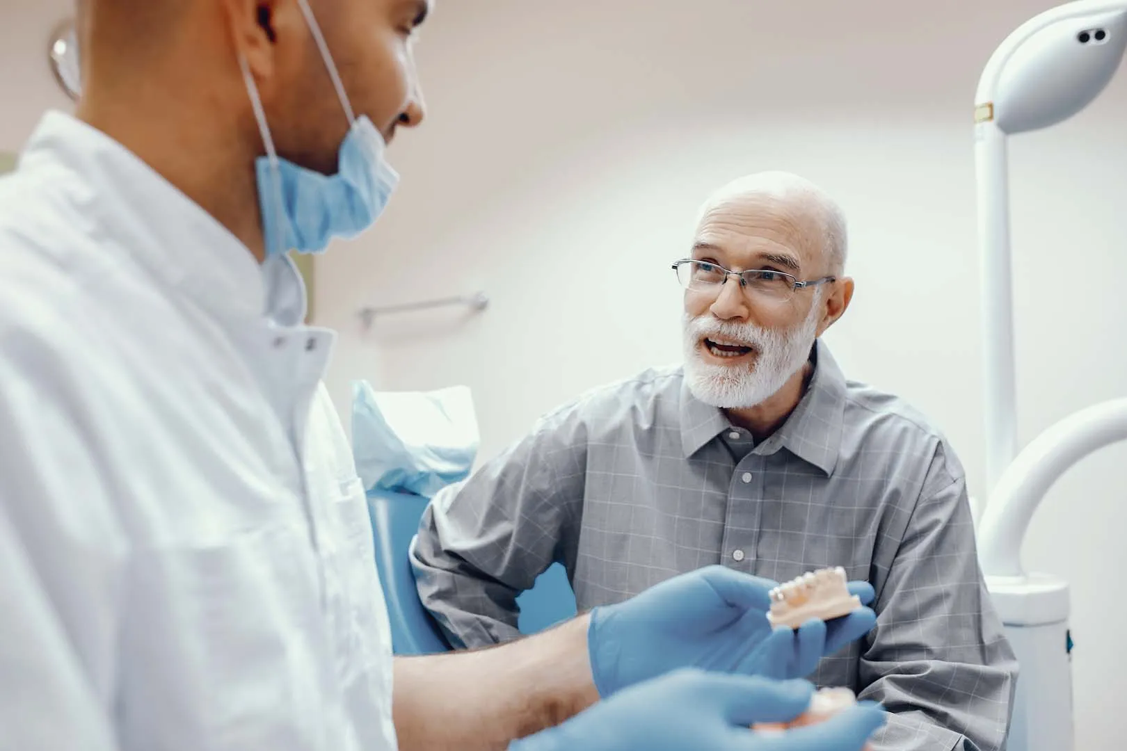 Patient smiling after All-on-4 full mouth restoration